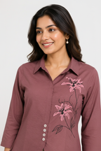 Close-up - pink lily embroidery on mauve