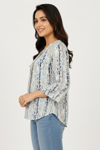 Side profile - blue watercolour stripe bell sleeve top