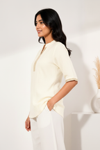 Side three-quarter pose - cream kurti