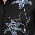 Texture shot - sequin lily on black fabric